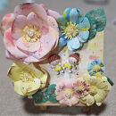 「笑顔の花が咲く場所」世界に一つの似顔粘土の制作、画用紙をローラーで着色した世界に一つのお花で作品を作ります。